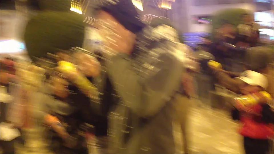 A blur of people and spray foam at the festival in Puno.