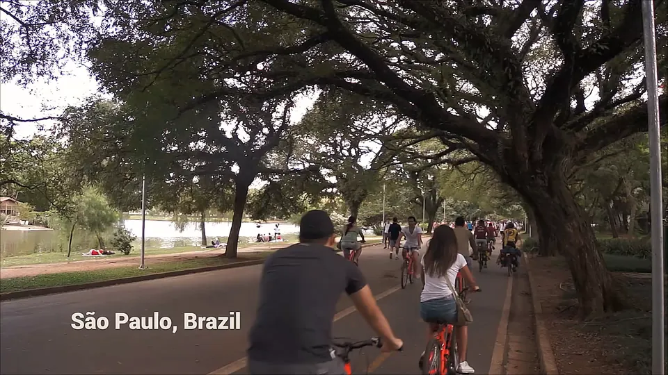 Riding through a park among local cyclists. Caption: São Paulo, Brazil.